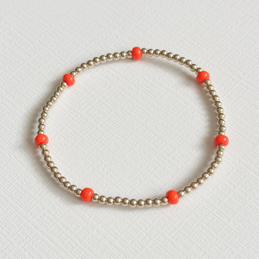 Dainty Orange Splash Bracelet in Gold